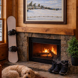 Lodge lounge with  artwork of a snow-covered countryside with rolling hills, simple buildings, trees and a wooden fence under a soft winter sky, creating a calm and reflective winter scene.